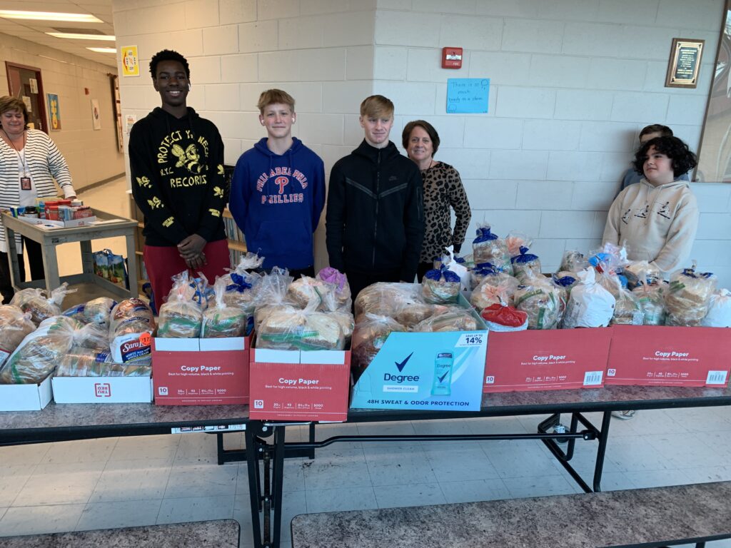 Students and guidance counselors from John A. Carusi Middle School in Cherry Hill, NJ, pose after making over 1,000 sandwiches for its Martin Luther King Jr. Week of Service in 2022. 